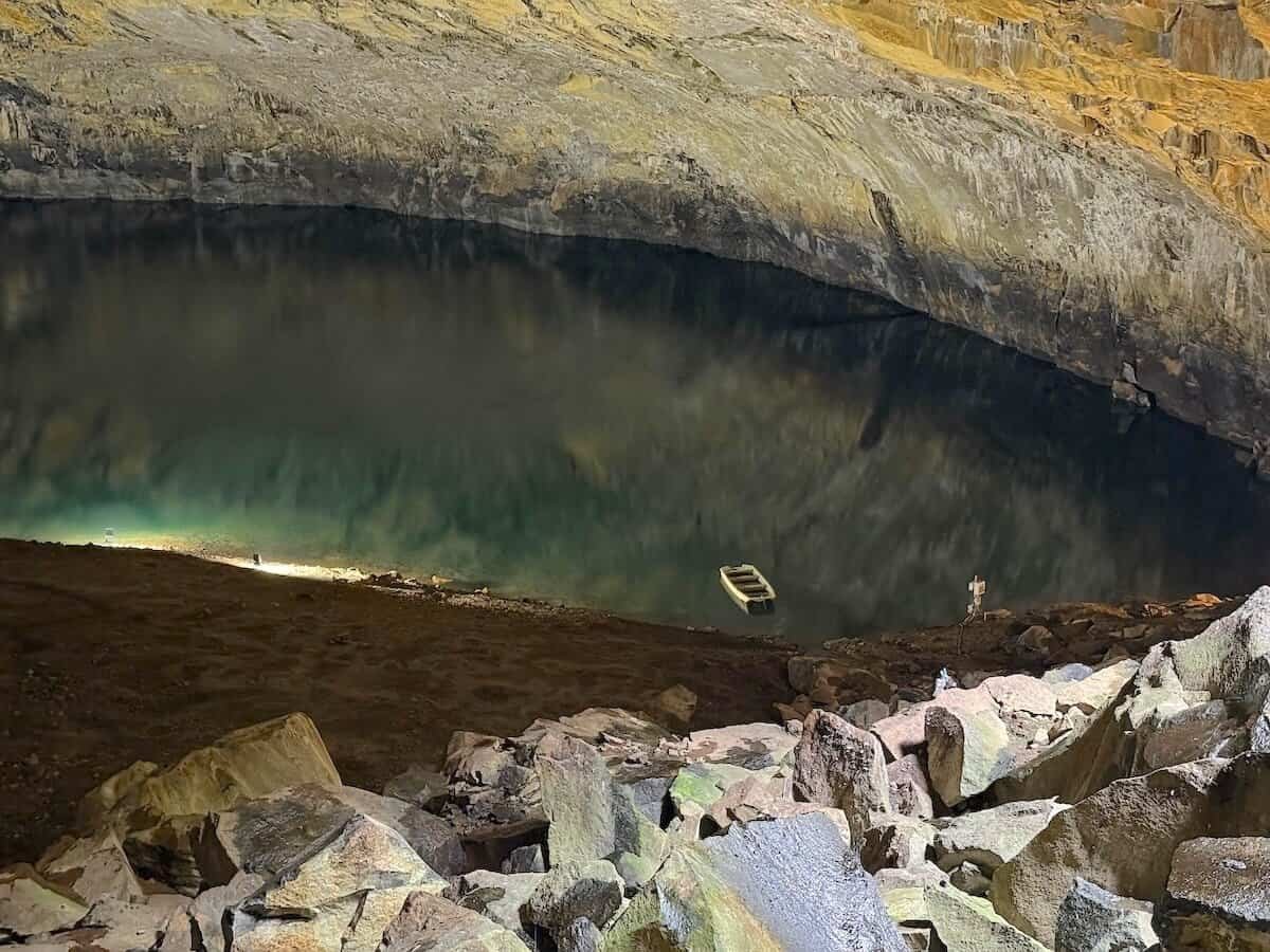 Furna do Enxofre, an underground volcanic cave and lake with small boat on Graciosa in Azores