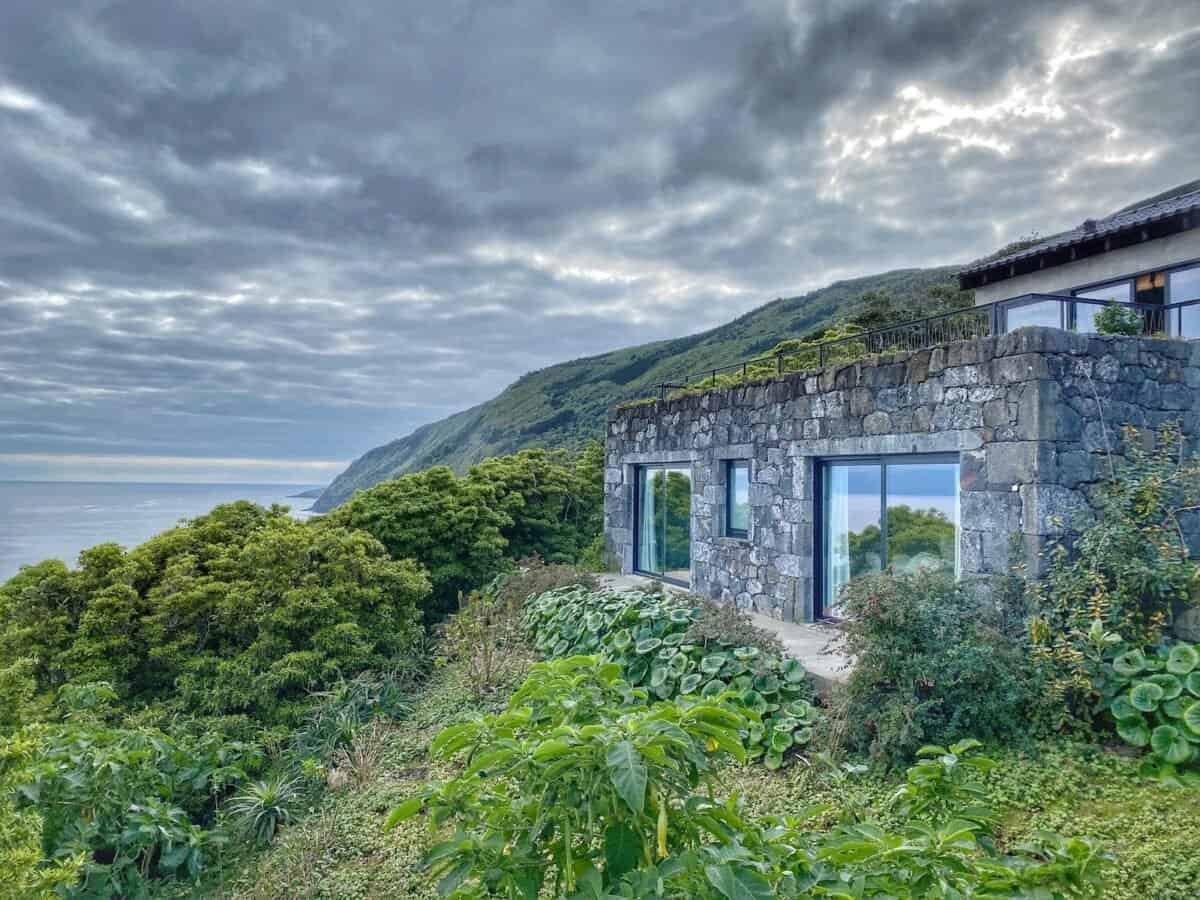 traditional stone house on steep coast on Pico Island in the Azores